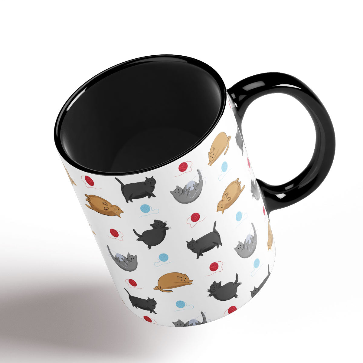 Cute Fat Cats pattern separated by balls of wool. Black Handle and interior.